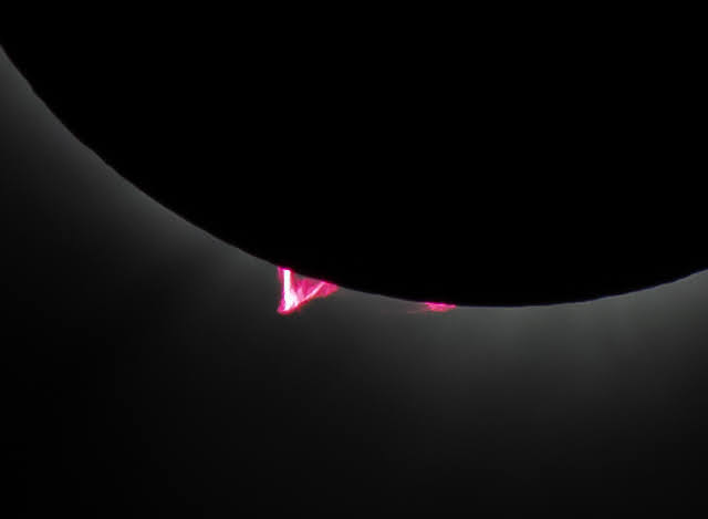 Prominences visible during totality. This one is considerably larger than our planet Earth!